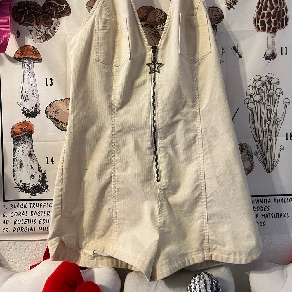Halter shorts jumpsuit with star keychain zip up in the front. - Picture 2 of 7